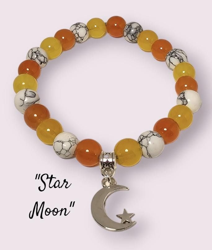 Silvery moon and star charm with yellow, orange and white marble beads. Adjustable White Jewelry With Sun And Moon Design, Adjustable White Moon Bracelet, Adjustable White Moon Shaped Bracelets, Adjustable White Sun And Moon Jewelry, Adjustable White Moon-shaped Bracelets, Bohemian White Star Jewelry, White Bohemian Star Jewelry, White Moon-shaped Bracelets For Gifts, White Moon Shaped Bracelet Gift