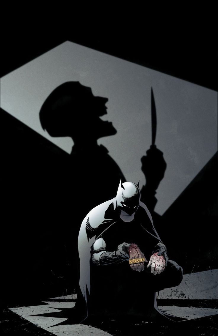 the shadow of a batman standing next to a knife