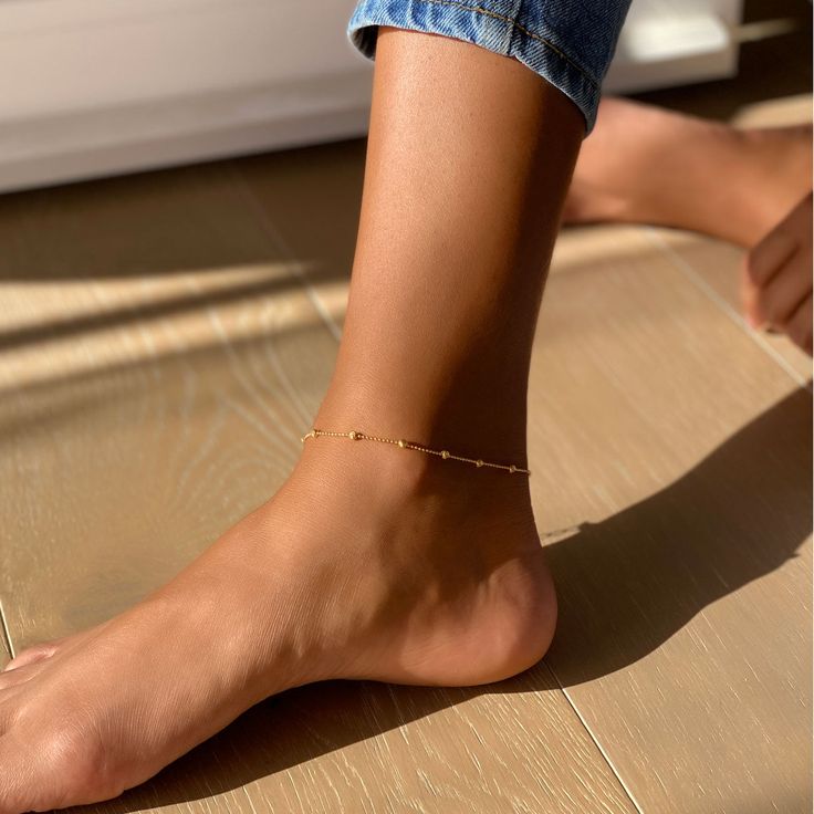 Add something sparkly to your ankle with this minimal anklet. Tiny Diamond cut beads on a delicate chain. .925 Sterling Silver Italian Diamond Cut Chain, 1mm Hypoallergenic, lead and nickel free Length: 9-10in (23-25.3cm) Chain Thickness 1mm Lobster clasp closure Handcrafted in NYC #ANK007 Dainty Hypoallergenic Anklets For Everyday Use, Dainty Hypoallergenic Everyday Anklets, Minimalist Anklet With Satellite Chain As Gift, Minimalist Satellite Chain Anklet As Gift, Dainty Adjustable Beaded Chain Anklets, Adjustable Satellite Chain Anklet As Gift, Minimal Anklet, Satisfying Pictures, Bead Anklet