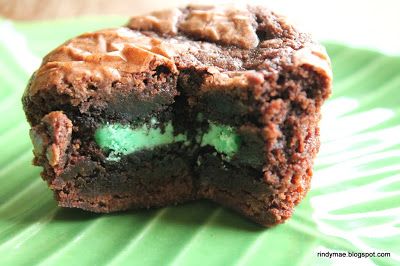 a close up of a chocolate cookie with green frosting