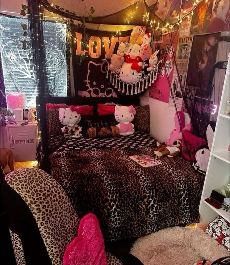 a bedroom decorated in leopard print with teddy bears on the bed and lights strung above