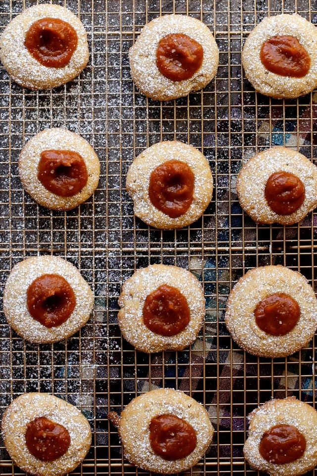 freshly baked cookies with powdered sugar and ketchup on a wire cooling rack