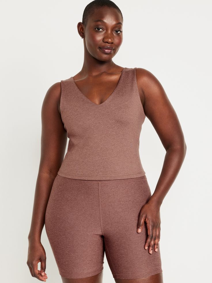 v-neck wide straps go-dry wicks moisture breathable fitted hits at natural waist provides light support for a-c cups models are approx.  5'9" and wear sizes s (4), l (12), and xl (18)machine wash according to the care instruction label V-neck Athleisure Activewear For Loungewear, Fitted V-neck Sports Bra For Yoga, Compressive V-neck Top For Athleisure, Seamless V-neck Athleisure Top, Seamless V-neck Tank Top For Gym, V-neck Tank Top With Built-in Bra For Workout, V-neck Workout Tank Top With Built-in Bra, Fitted V-neck Top For Relaxation, Workout V-neck Tank Top With Built-in Bra