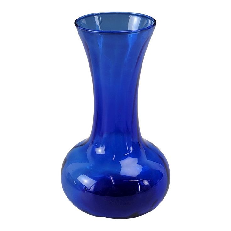 a blue vase sitting on top of a white table