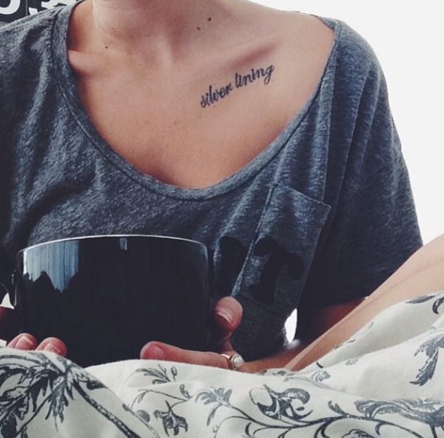 a woman is holding a coffee cup with the words above her head on her chest