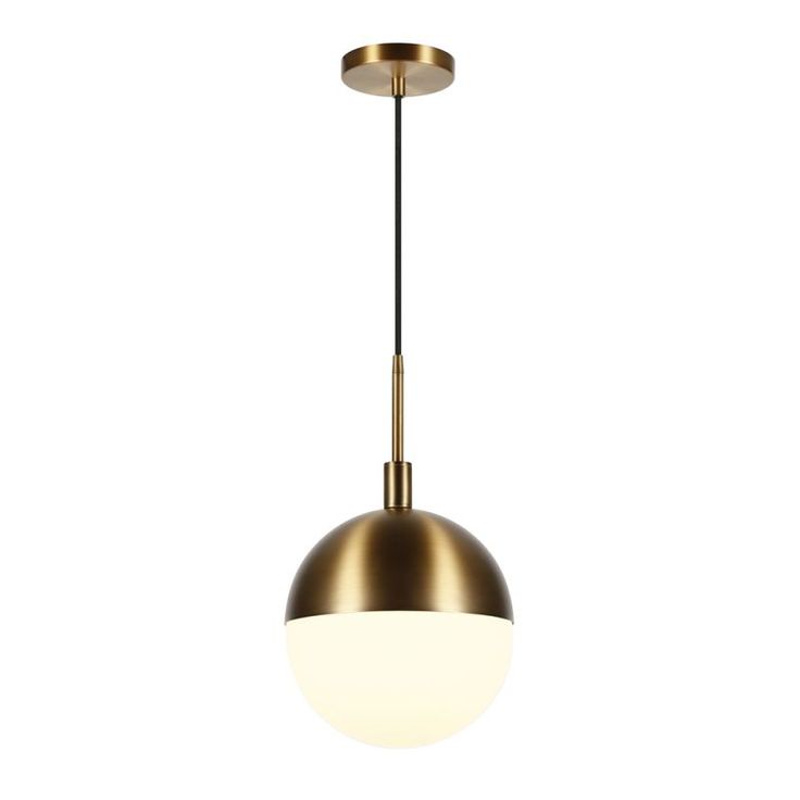 a brass colored light fixture with a white glass ball hanging from it's side