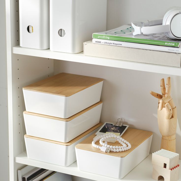 the shelves are filled with boxes and other items for storage, including bracelets and jewelry