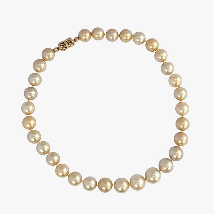 Indulge in the elegance and natural beauty of this stunning South Sea pearls necklace, featuring cultured Golden South Sea pearls sourced from Indonesia. Crafted with meticulous attention to detail, this necklace is a testament to exceptional craftsmanship and exquisite materials. Secured with a 14K yellow gold 'twist and lock' clasp, the necklace measures 17.25 inches (43.5cm) in length, draping gracefully around the neckline. The weight of 95.7g adds a substantial feel and underscores the luxu South Sea Pearl Necklace, Akoya Pearl Necklace, Golden South Sea Pearls, Pearls Necklace, Sea Pearl, Sea Pearls, Akoya Pearls, Tahitian Pearls, South Seas