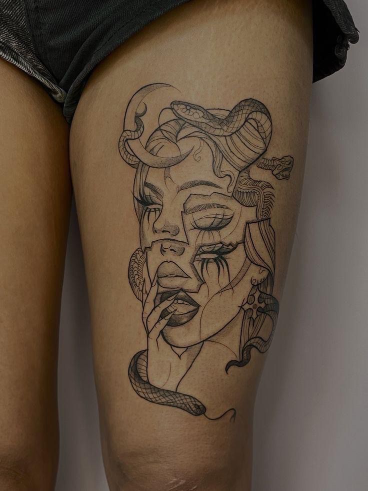 a woman's thigh with a tattoo on it