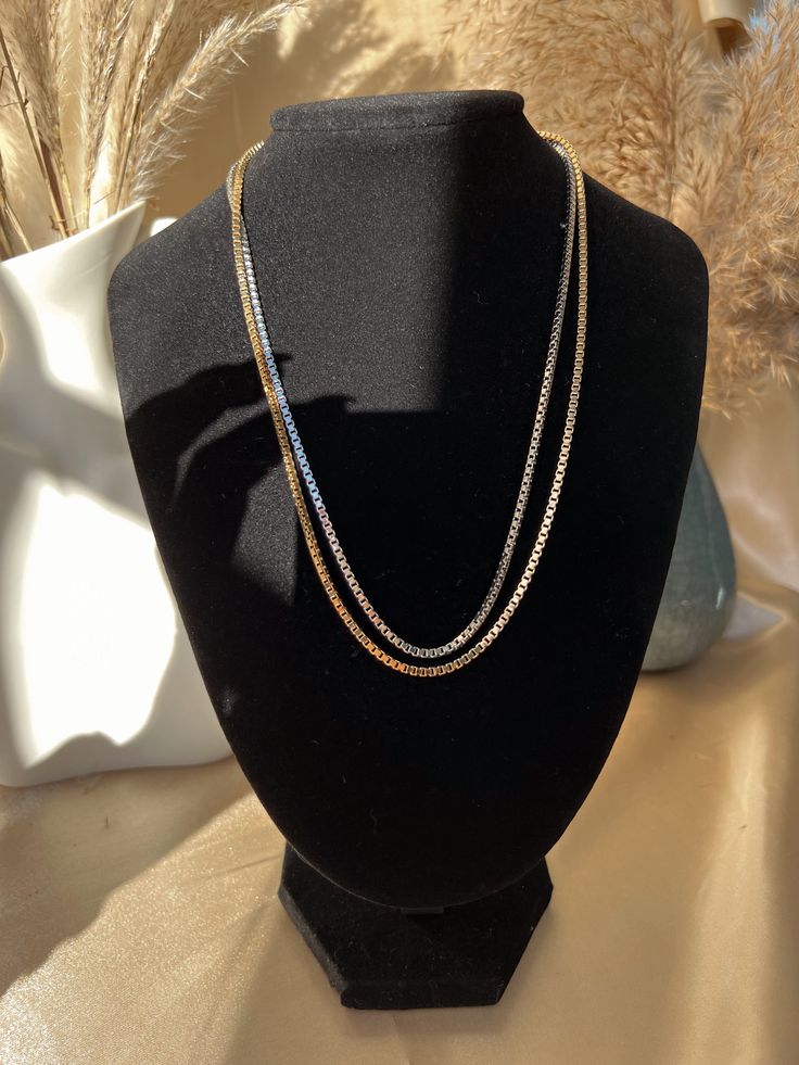 This stunning 18K Gold Filled chain is perfect for layering, everyday wear, or to be dressed up! Wear it simply, or pair with your favorite GH Pendants! Note: Chain and pendants sold separately. Material: 18K Gold Filled or 18K Rhodium Filled Length: 18" Inch Chain Thickness: 2mm Double Strand Box Chain Necklace For Gift, Double Strand Box Chain Necklace For Gift Giving, Gift Double Strand Box Chain Necklace, Formal Double Snake Chain Necklace, Silver Gold-plated Box Chain Necklace, Gold Snake Chain Necklace For Layering, Classic Gold Chain Necklace For Layering, Snake Chain Gold Necklace For Layering, Gold Double Strand Box Chain Necklace