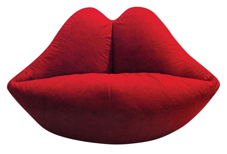 a large red couch sitting on top of a white floor