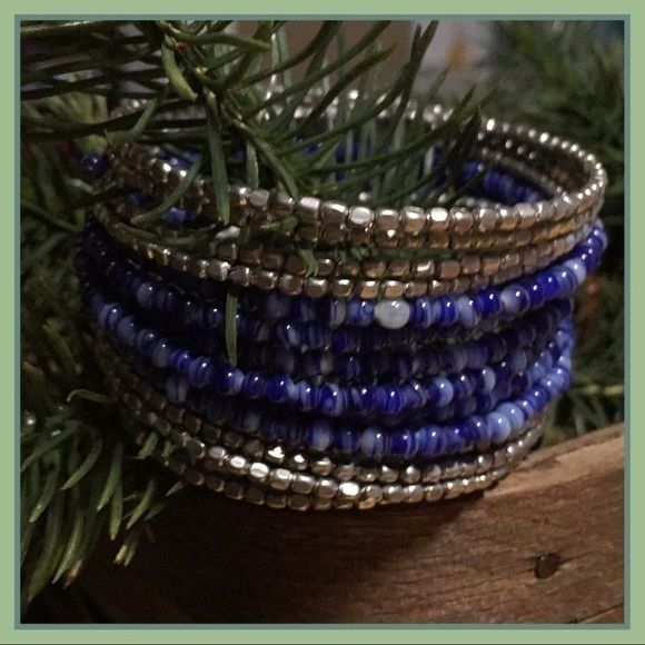 Hannah Accents Bead-And-Wire Wrap Bracelet That Fits Most Wrist Sizes Due The Wrapping Of The Piece Around Your Wrist. Cute Variegated Beads And Distressed Gold Beads Blue Wrap Bracelet With Colorful Beads, Blue Wrap Bracelet With Spacer Beads, Adjustable Blue Wrap Bracelet With Faceted Beads, Blue Beaded Stretch Bangle Bracelet, Blue Wrap Bracelet With Colorful Beads As Gift, Blue Wrap Bracelet With Colorful Beads For Gifts, Blue Spacer Beads Bangle Jewelry, Adjustable Beaded Blue Wrap Bracelet, Blue Bangle With Spacer Beads