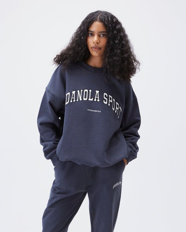 Adanola Sport Women's Oversized Sweatshirt - Midnight Blue | Adanola Oversized Blue Sweats For Loungewear, Oversized Letter Print Sportswear Sweats, Oversized Varsity Sweatshirt For Sports, Oversized Letter Print Sweats Sportswear, Oversized Letter Print Sweats In Sportswear Style, Blue Varsity Oversized Sweatshirt, Blue Oversized Varsity Sweatshirt, Oversized Letter Print Sweats For Sports, Oversized Sweats With Letter Print For Sports