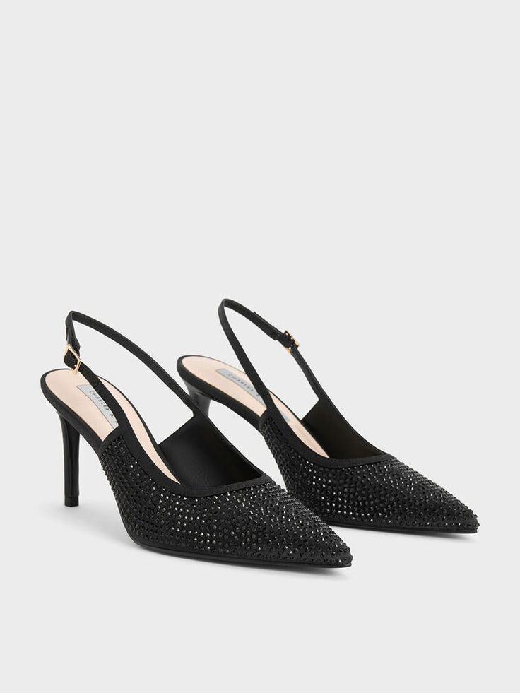 Strike the perfect balance between looking subtly glamorous and making a statement with these satin crystal-embellished slingback pumps. In an all-black finish, these pumps are embellished with crystals in the same colour for an understated finish that only showcases its brilliance when it catches the light. With adjustable slingback straps that allow you to find a comfortable and secure fit, these heels are easy to slip on and wear all night long. Sling Back Heels, Charles Keith, Black Textures, Slingback Pump, Black Pumps, Black Satin, All Black, Slip On, Pumps