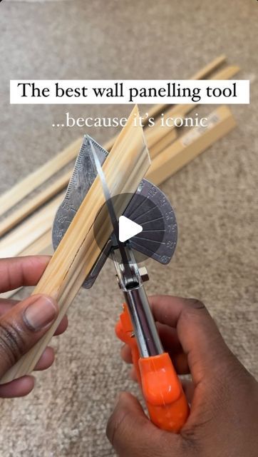 someone is using a pair of pliers to cut the wood with their thumbnails