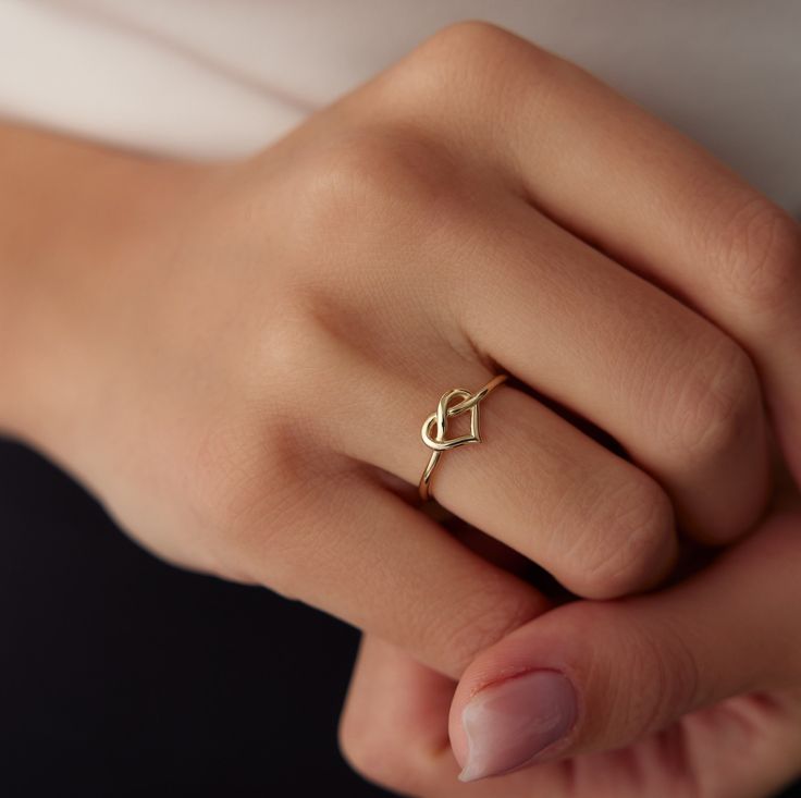 Elegant 14K Gold Minimalist Rings by Yunka Jewelry Discover the timeless elegance of our 14K gold minimalist rings, meticulously crafted to add a touch of sophistication to any outfit. Whether you prefer stacking them together or wearing them solo, these dainty rings are perfect for everyday wear or special occasions. Each ring is designed with unique elements, from delicate hearts and butterflies to intricate twists and geometric shapes, ensuring there's a perfect match for every style. Product Delicate 14k Gold Heart Ring For Everyday, Delicate Everyday Heart Ring In 14k Gold, Delicate Everyday 14k Gold Heart Ring, Elegant 14k Gold Everyday Heart Ring, Simple Yellow Gold Heart Ring For Anniversary, Elegant Heart Cut Rings For Everyday, Elegant Everyday Heart Cut Ring, Elegant Sterling Silver Heart Ring For Everyday, Minimalist 14k Gold Heart Promise Ring