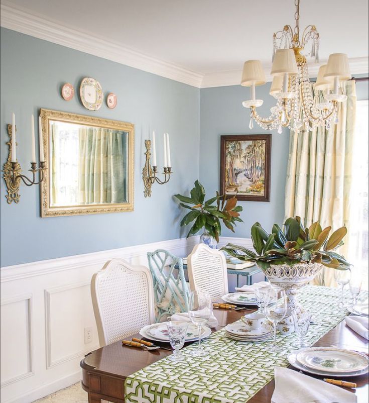 the dining room table is set with place settings