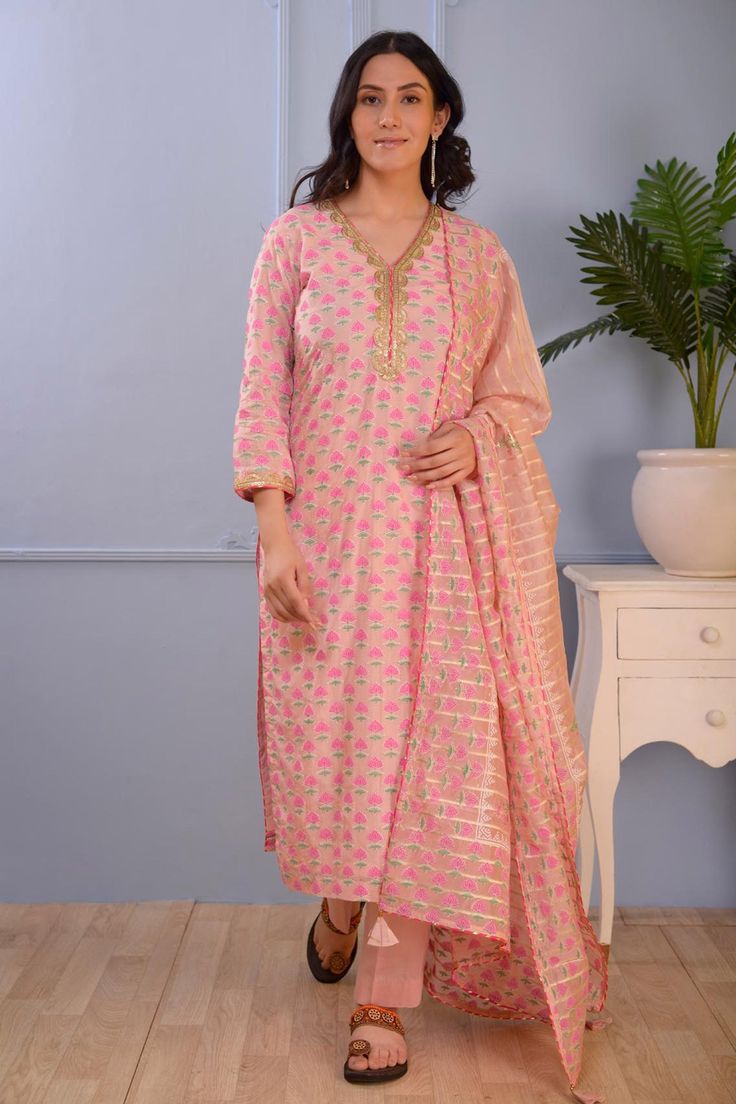 Pink cotton silk kurta with floral block print motifs all over and embroidered neckline. Comes with straight fit pant and dupatta.
Component: 3
Pattern: Print and Embroidery
Type Of Work: Floral
Neckline: V Neck
Sleeve Type: Three quarter
Fabric: Kurta- Cotton Silk;
Pant- Cotton Satin;
Dupatta- Viscose Stripe Organza 
Color: Pink
Other Details: 
Block print
Scallop embroidered neckline
Organza striped dupatta
Occasion: Puja - Aza Fashions Satin Dupatta, Print Motifs, Kurta Cotton, Floral Block Print, Silk Pant, Straight Fit Pants, Silk Kurta, Embroidered Neckline, Pink Cotton