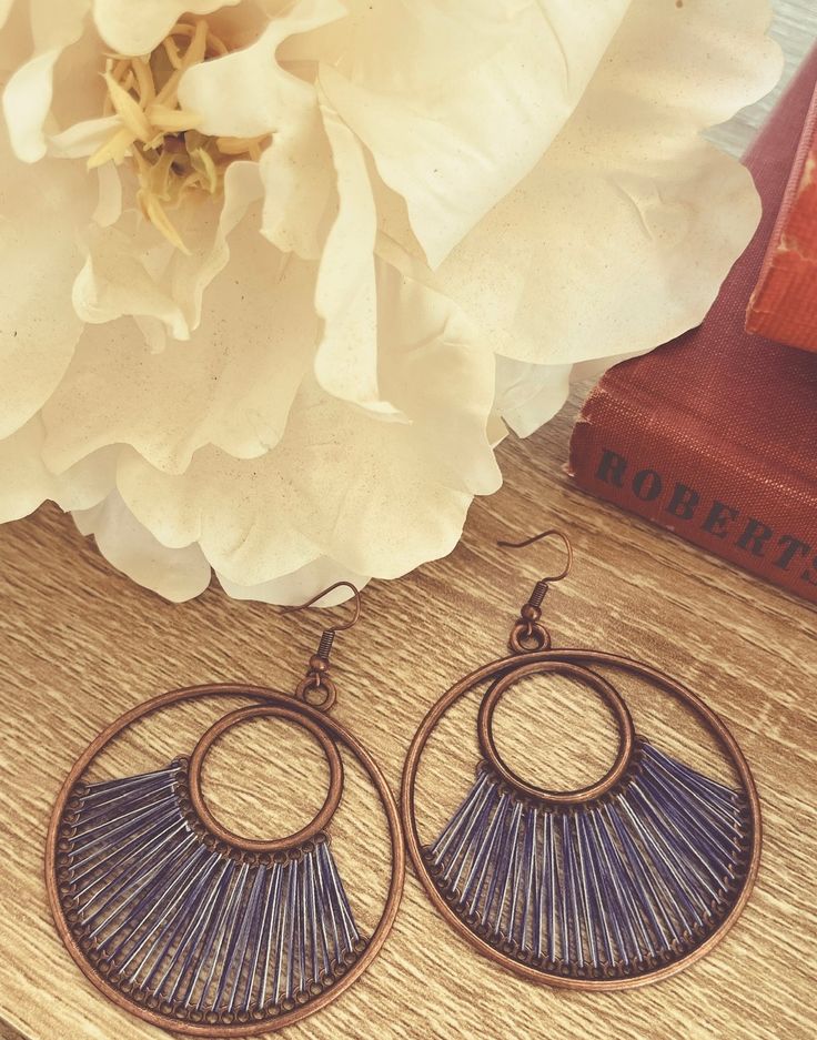 These Beautiful Artistic Blue String Earrings are a stunning addition to any jewelry collection, featuring delicate string detailing in a striking blue hue. Measures 2 inches. String Earrings, Book Jewelry, Yellow Earrings, Holiday Jewelry, Wood Earrings, Leather Necklace, Blue Hues, Silver Turquoise, Green And Orange