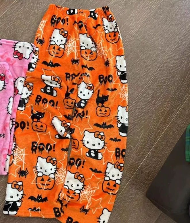 Sanrio Hello Kitty Pajama Pants provide maximum comfort with a stylish design. These cotton blend pants feature an elastic waistband, as well as Sanrio's iconic Hello Kitty character. Perfect for a comfortable night in or a lazy day lounging around. Hello Kitty Pjs Halloween, Halloween Pjs Pants, Halloween Hello Kitty Pants, Cozy Halloween Outfits, Cute Cartoon Print Bottoms For Sleepover, Cute Halloween Pajama Party Sleepwear, Cute Halloween Sleepover Sleepwear, Halloween Pjs Aesthetic, Halloween Pj Pants