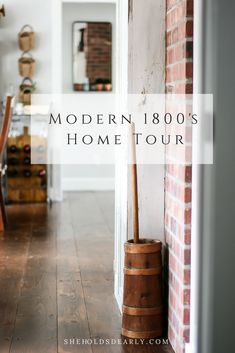 the modern 1800's home tour is on display in this photo, with an old barrel leaning against the wall