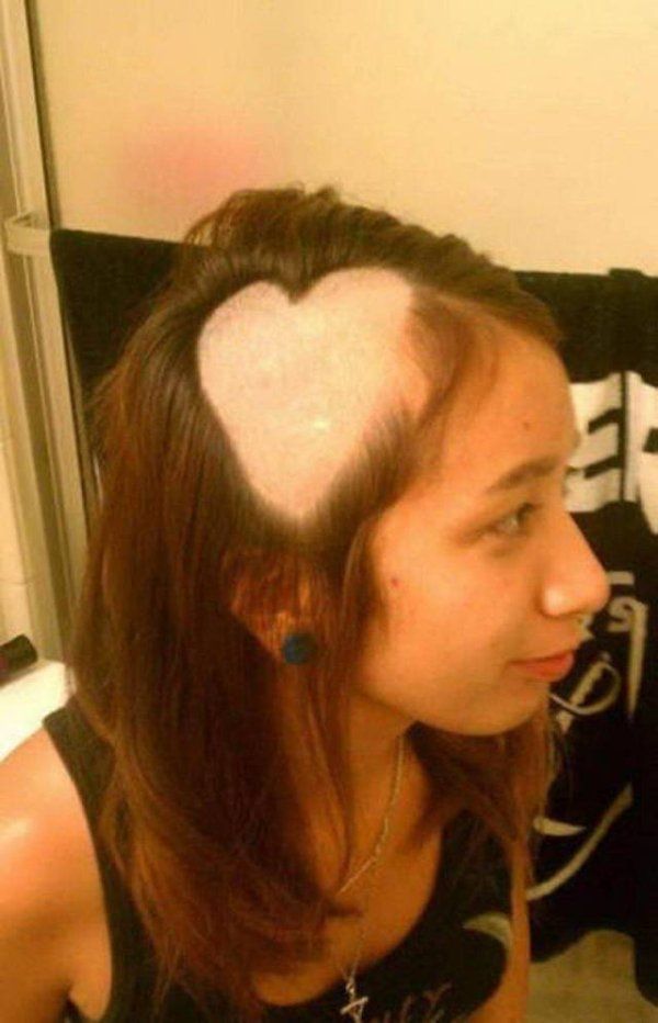 a woman with her hair in the shape of a heart