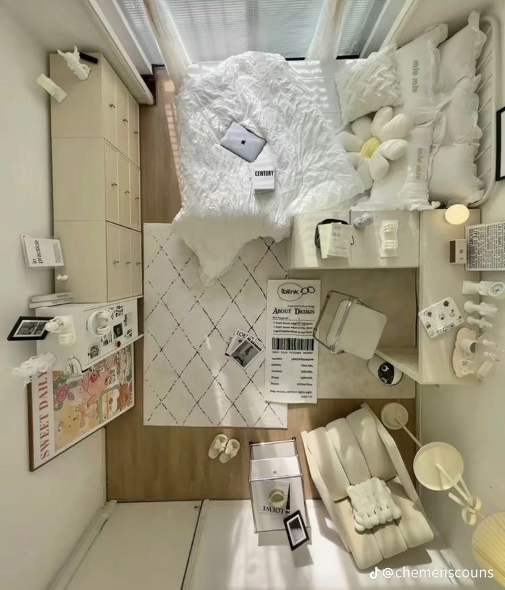 an overhead view of a small bedroom with white furniture and accessories on the floor,