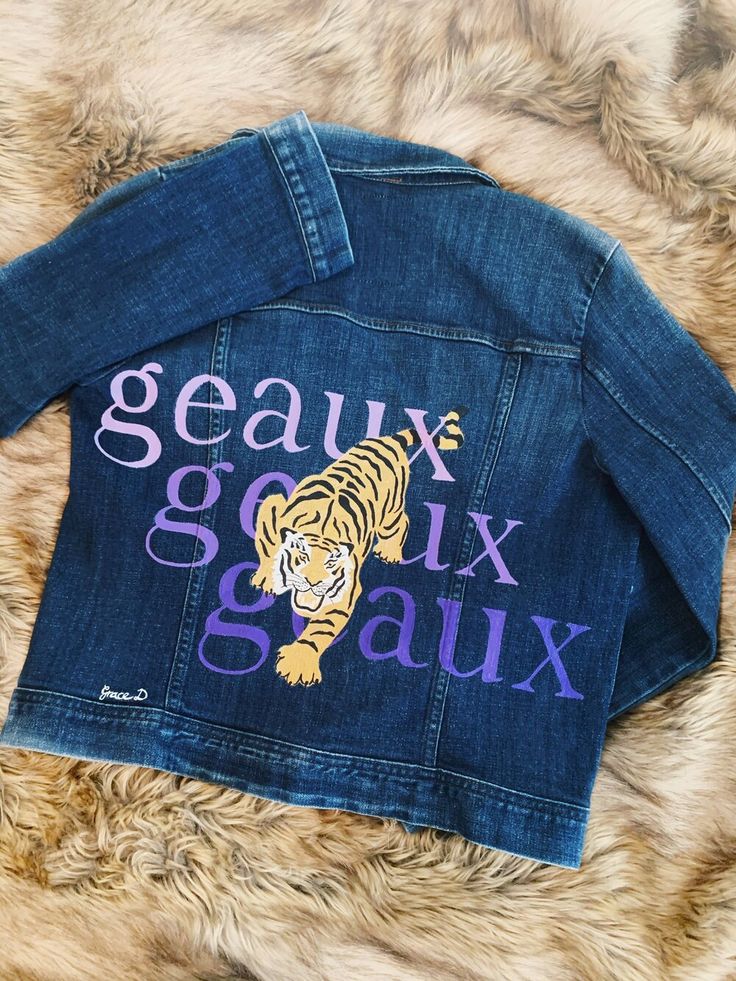 — Fleur Art & Designs Jean Jacket Design, Painted Jean Jacket, Jean Jacket Diy, Custom Jean Jacket, Diy Denim Jacket, Gold Tiger, Hand Painted Denim Jacket, Tailgate Outfit, Painted Denim Jacket