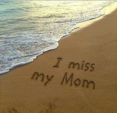 a message written in the sand on a beach next to the ocean with waves coming in