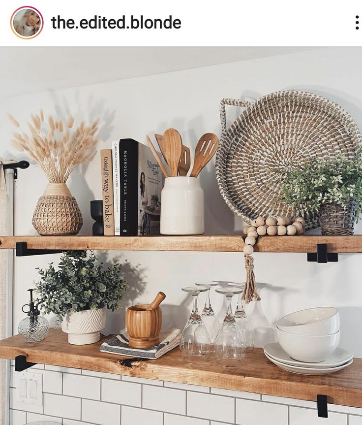 the shelves are filled with dishes and utensils on top of them, along with other kitchen items