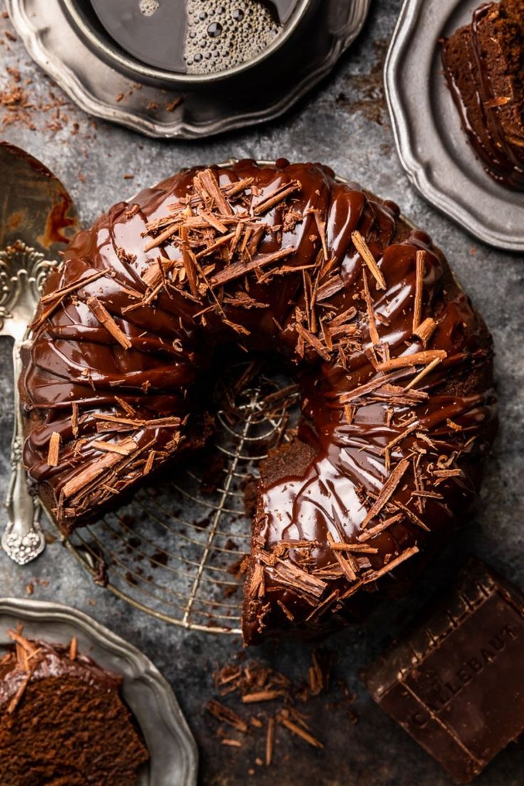 a chocolate bundt cake with one slice cut out