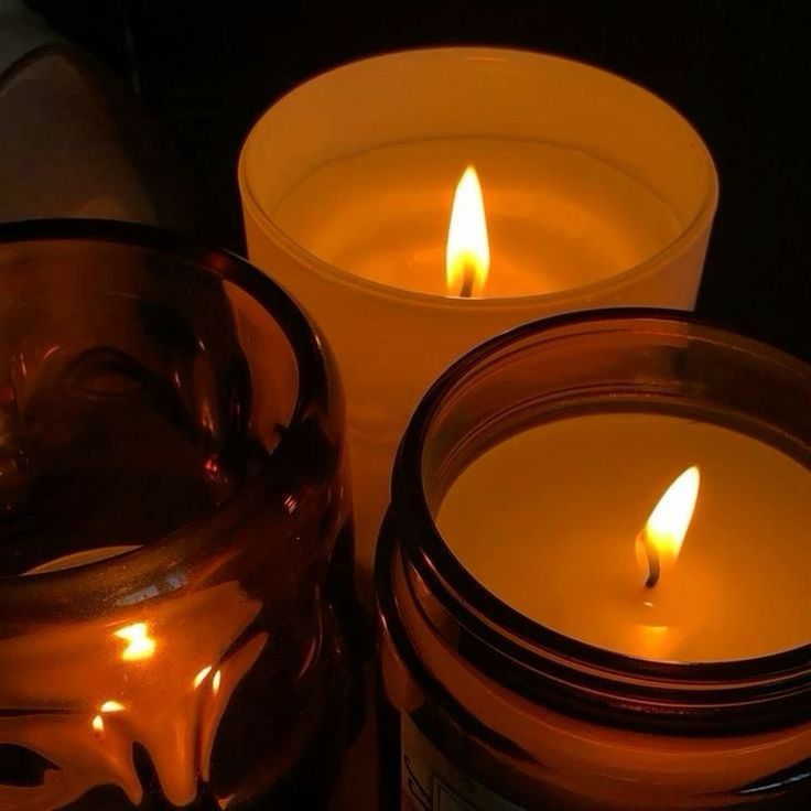 two candles sitting next to each other on a table