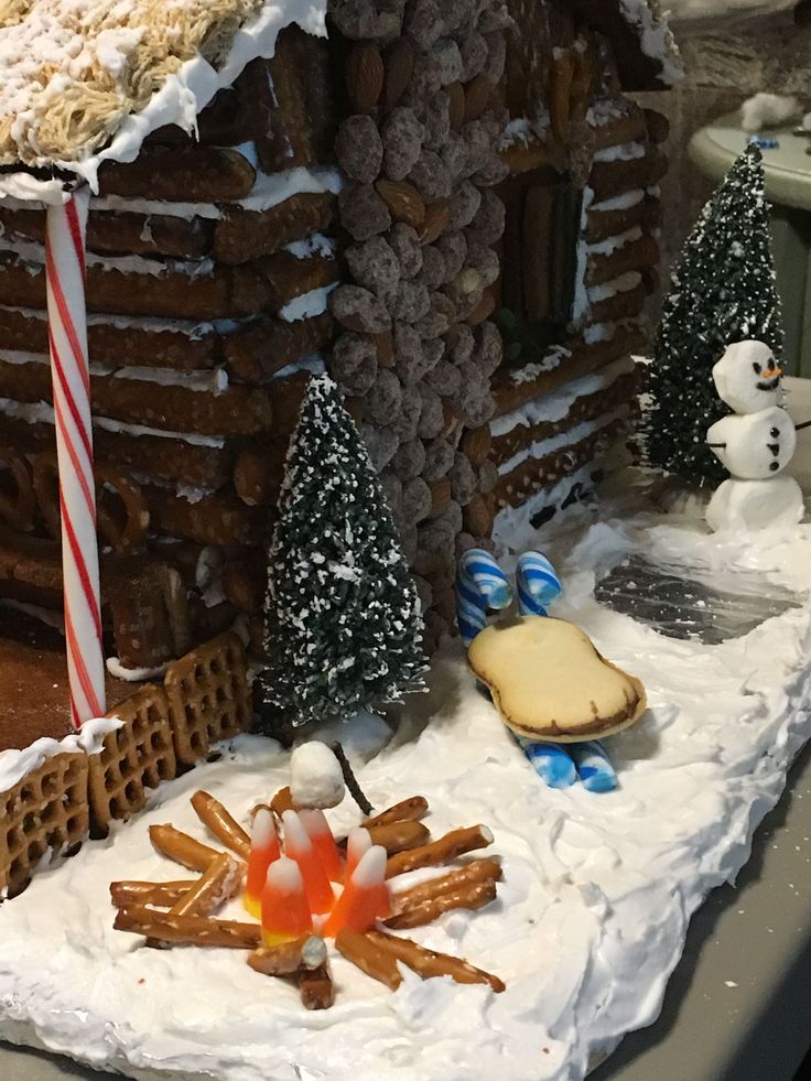 a close up of a gingerbread house on a table