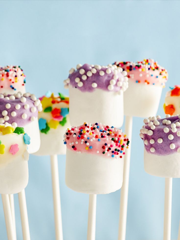 colorful cake pops with sprinkles on them