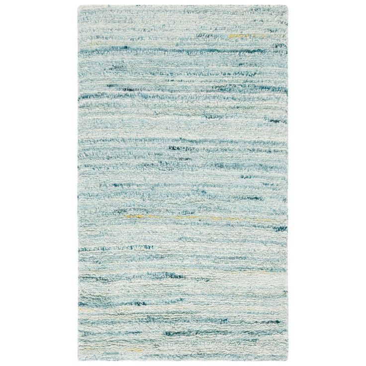 an area rug with blue and white stripes on the side, in front of a white background