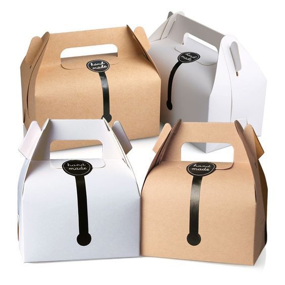 four different colored boxes with black handles