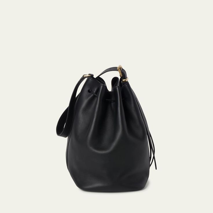 Miu Miu bucket bag in fine calf leather  Adjustable buckle shoulder strap  Drawstring closure  Approx. 11.4"H x 6.7"W x 5.1"D Made in Italy Miu Miu Shoulder Bag With Gold-tone Hardware For Travel, Luxury Bucket Bag With Adjustable Strap For Office, Luxury Office Bucket Bag With Adjustable Strap, Miu Miu Tote Shoulder Bag For Travel, Miu Miu Travel Tote Shoulder Bag, Classic Miu Miu Bags For Everyday, Miu Miu Formal Shoulder Bag With Gold-tone Hardware, Formal Miu Miu Shoulder Bag With Gold-tone Hardware, Miu Miu Travel Bag With Gold-tone Hardware