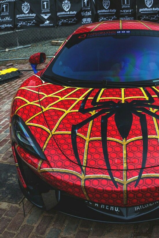 a red sports car with spider - man decals on it