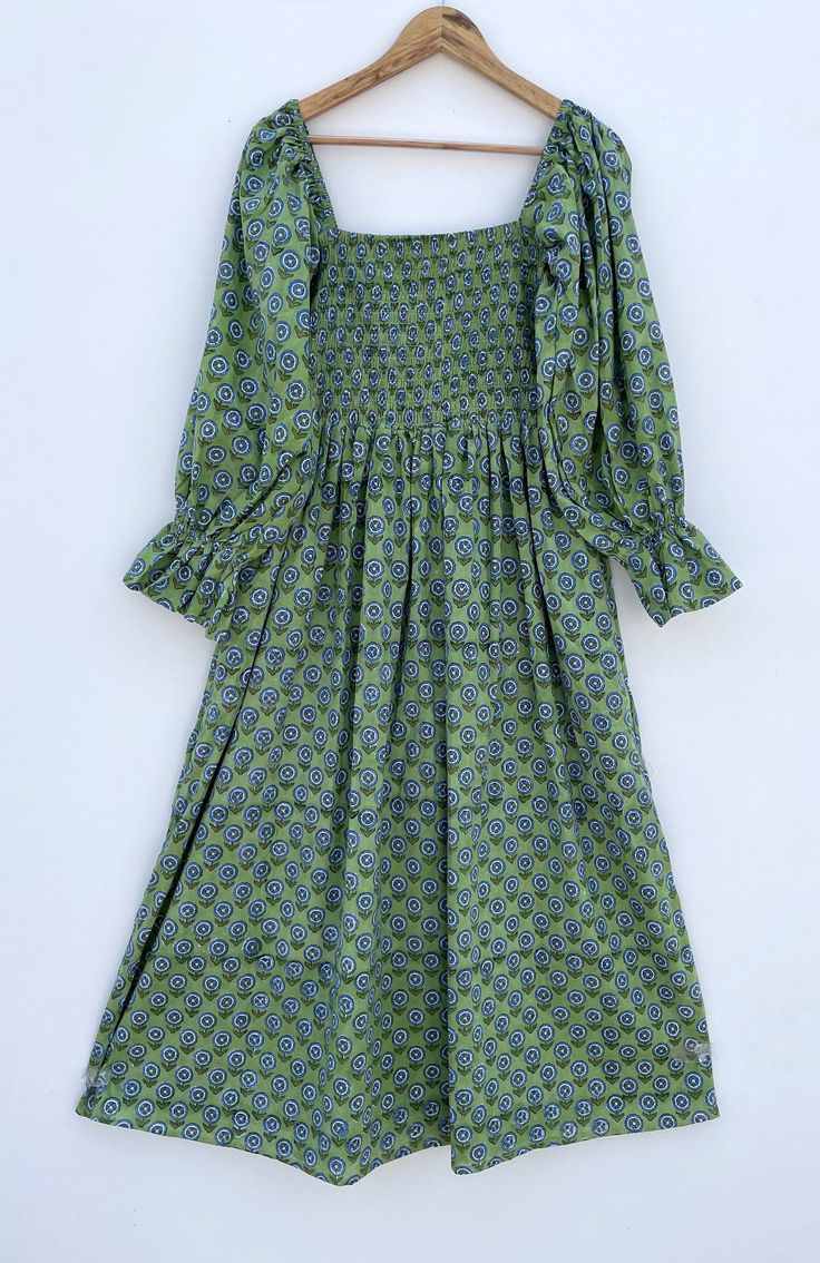 DESCRIPTION green blue little booty printed cotton summer maxi dress / square neckline with smocking maxi dress / long sleeve bohemian maxi dress Indian (Jaipur) Traditional Hand Block Printed Dresses for summer vacations, beaches wear, party wear, and more occasions to wear this dresses. PRODUCT DETAILS: Long sleeve, square neck, Long dress FABRIC: soft and breathable cotton cambric WASH CARE:  wash in cold water, air dry in shade.. SLEEVE LENGTH - 22 inch Size chart is mentioned in images. Size chart is given of the garment not the person wearing the garment We will be happy to customize according to your measurements. Message us for custom wholesale orders. Color of given picture may slightly vary due to sunlight, screen's resolution and camera focus. also you can write for more informa Fitted Cotton Smocked Bohemian Dress, Fitted Cotton Smocked Dress With Square Neck, Fitted Bohemian Smocked Dress With Square Neck, Summer Long Sleeve Maxi Dress With Smocked Bodice, Cotton Smocked Dress With Square Neck For Beach, Bohemian Dress With Smocked Back And Square Neck, Cotton Smocked Dress With Square Neck, Summer Square Neck Smocked Dress With Elastic Sleeves, Summer Bohemian Smocked Cotton Dress