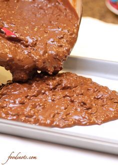 two pieces of chocolate cake sitting on top of a pan