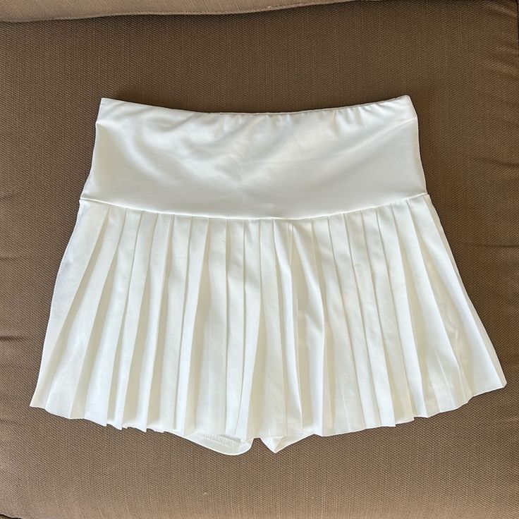 Never Worn White Athletic Skirt! Super Soft And Stretchy With Built In Spandex Underneath! Perfect For Summer! Need Gone So Make An Offer/Bundle With More To Save! White High Waist Swim Skirt For Spring, Summer Stretch Pleated Skort, Stretch White Pleated Bottoms, White Stretch Pleated Bottoms, Summer Pleated Stretch Skort, White Pleated Stretch Bottoms, Beach Mini Skirt Bottoms Pleated, Pleated Stretch Bottoms For Day Out, Pleated Stretch Swim Skirt For Summer