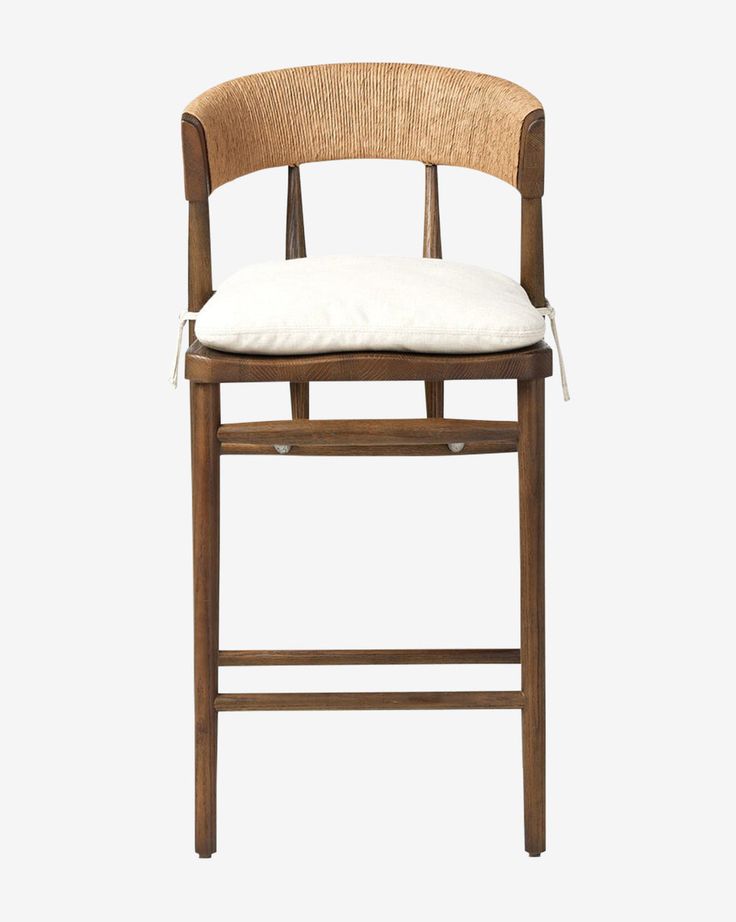 a wooden chair with a white cushion on the seat and backrest, against a white background