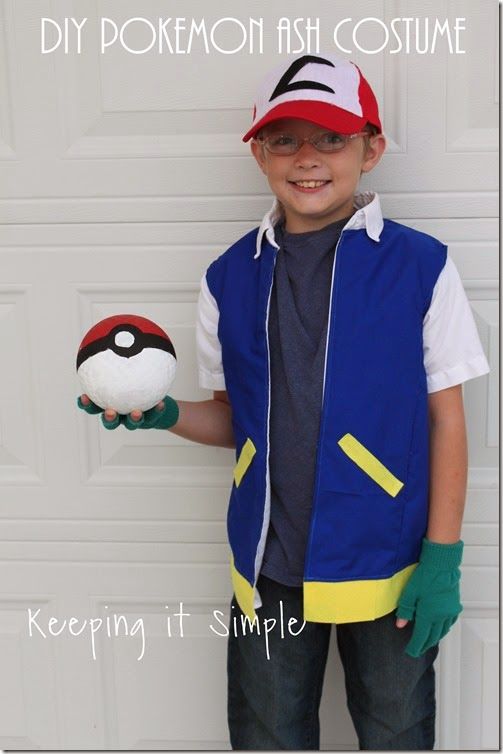 a young boy wearing a pokemon costume holding a pikachu ball