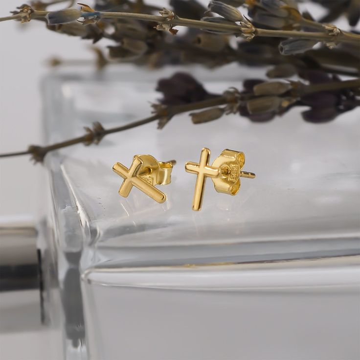 Gold Cross Stud Earrings: A harmonious blend of faith and fashion. Meticulously crafted, these earrings showcase a delicate cross design that exudes elegance. The Gold Cross Earrings reflect a deep reverence for spirituality, making them a meaningful accessory for any occasion. PRODUCT DETAILS: Material: 14K Solid Gold (real solid gold, no gold-filled or no gold plated material) Choice of Gold Color: Yellow Gold, Rose Gold, White Gold Location: Earlobe Closure: Push Back Style: Minimalist Whethe Elegant Hypoallergenic Cross Earrings, Elegant Hypoallergenic Cross-shaped Earrings, White Gold Cross Earrings For Gift, Gold Cross Pendant Earrings As Gift, Gold Cross Pendant Earrings For Gift, Yellow Gold Cross Earrings For Pierced Ears, Gold Hypoallergenic Cross Earrings, Gold Cross Hypoallergenic Earrings, Minimalist Gold Cross Earrings