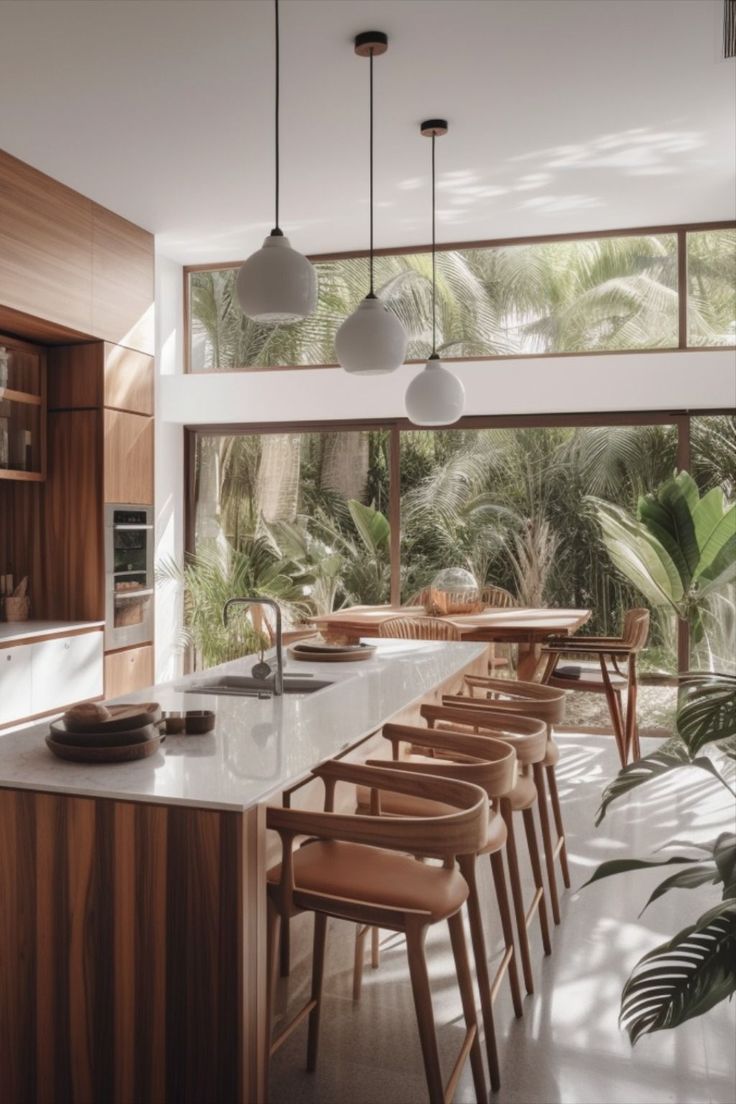 a kitchen with lots of counter space and chairs