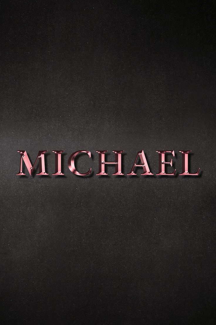 the word michael written in red on a black background with some light reflection from it