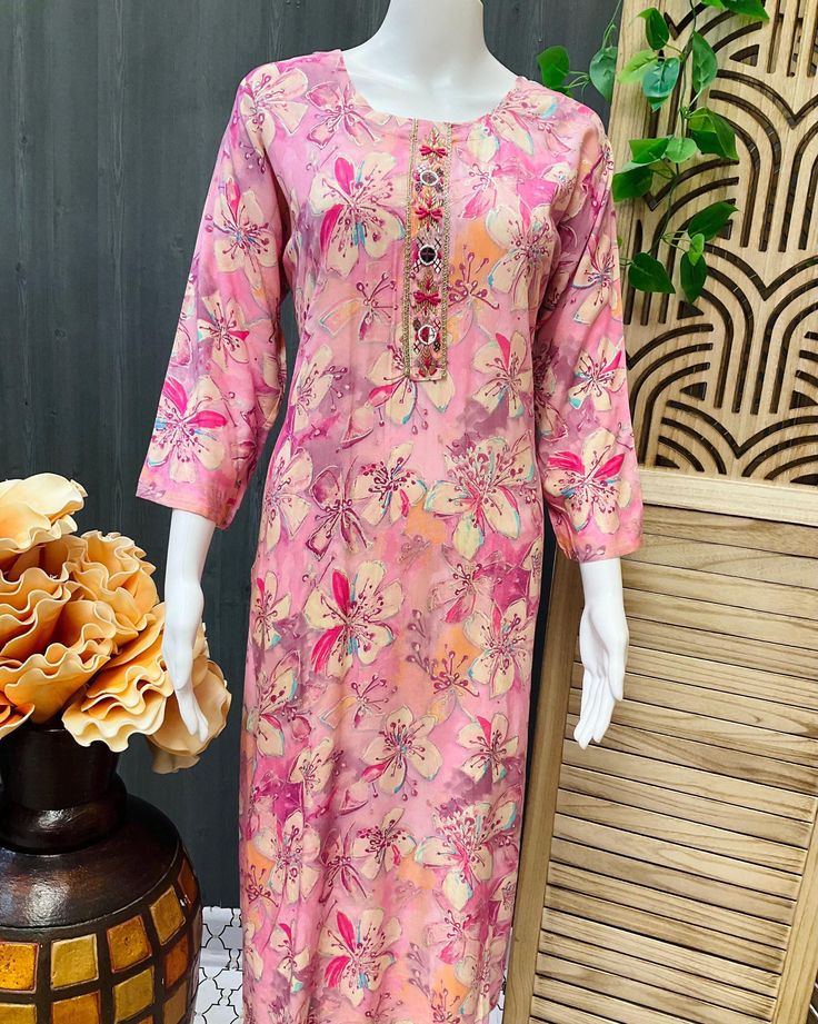 Discover timeless elegance with Anandi Fashions' Rayon Floral Print Pink Kurti. Perfect for any occasion, this exquisite piece combines traditional charm with modern comfort, making it a must-have in your ethnic wear collection. Made from soft, breathable rayon, this floral print kurti ensures you stay stylish and comfortable throughout the day. Please note that the color may slightly vary due to camera effects. Explore the curated collection at Anandi Fashions and elevate your wardrobe with the Elegant Cotton Palazzo Set With Cutdana, Diwali Cotton Silk Floral Print Kurta, Diwali Cotton Silk Kurta With Floral Print, Eid Cotton Silk Traditional Wear With Floral Print, Diwali Floral Cotton Silk Kurta, Festive Designer Floral Print Kurta, Floral Print Traditional Wear For Spring Festivals, Floral Print Traditional Wear For Festive Spring, Floral Traditional Wear For Festive Spring Season