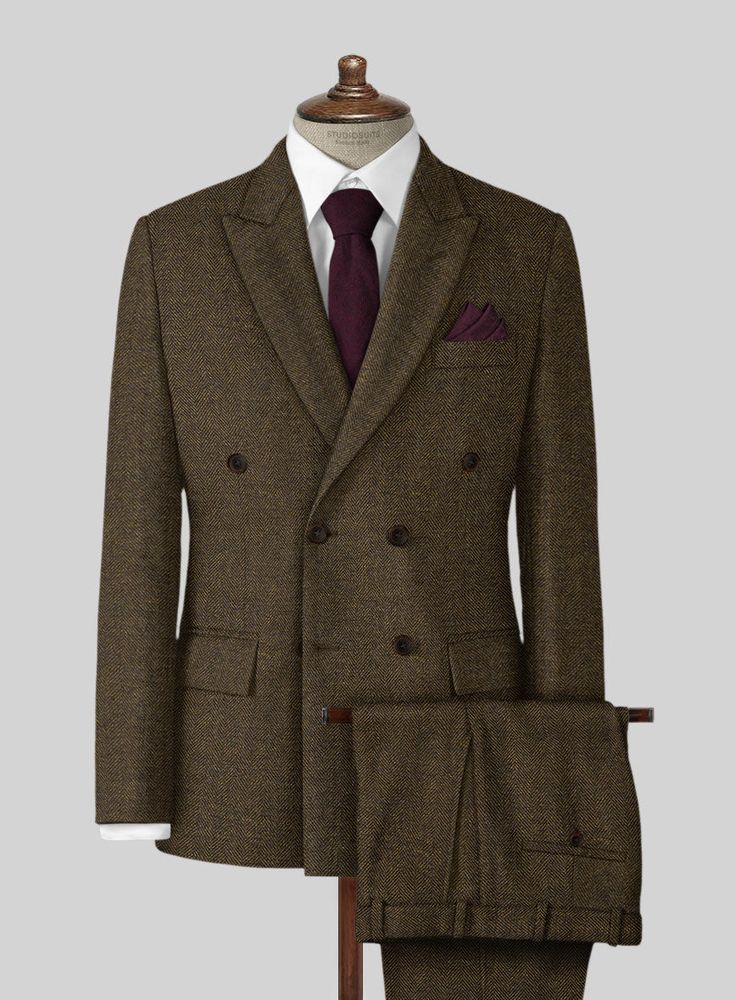 Wish you had an alternative to the countless charcoal grey and navy suits you continually wear to work, social events and weddings? Look no further than our Bottle Brown Herringbone Tweed Suit. Crafted from wool, the brown suit features a herringbone pattern that brings a breath of fresh air into it, while the tweed fabric makes it a perfect choice for wintry weather. Simply team it up with a white shirt and polished black shoes to achieve this look. 
 
Look Includes   Bottle Brown Herringbone T Brown Tailored Tweed Jacket For Formal Occasions, Brown Tweed Blazer For Formal Occasions, Formal Brown Tweed Blazer, Winter Formal Tweed Three-piece Suit, Formal Fitted Brown Tweed Jacket, Elegant Tweed Suit With Herringbone Pattern, Tailored Brown Wool Suit, Brown Wool Suits With Suit Collar, Brown Double Breasted Business Suit