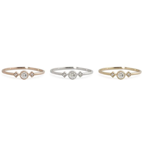 three different types of rings with diamonds on each one and the other two are gold, silver