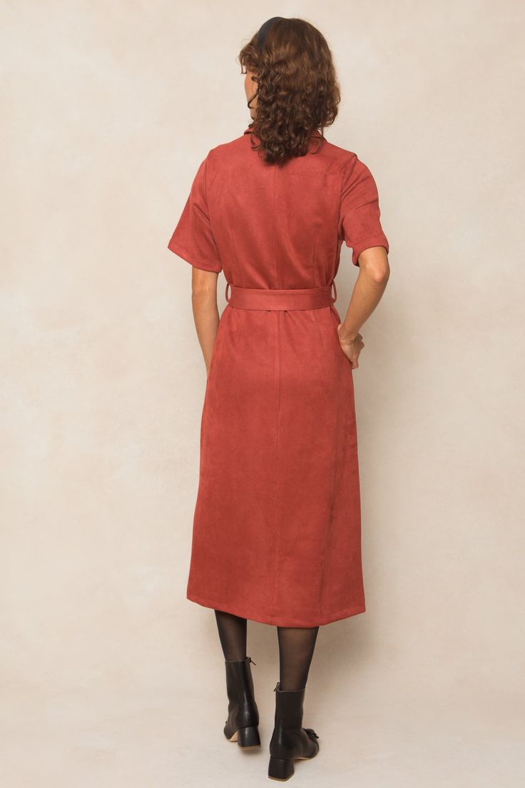 Be the talk of the town in our Rory Suede Dress! Made from luxurious suede, this women's dress features a v-neckline with a collar and half-length fitted sleeves. The midi-length skirt has pockets and functional buttons, while the button up style comes with a removable sash for a flattering fit. Plus, it's nursing friendly - practical and stylish! Fall V-neck Shirt Dress With Pockets, Fall Midi Dress With Buttoned Pockets, Fall Midi-length Dresses With Buttoned Pockets, Fall Midi Dress With Short Sleeves For Workwear, Fall Midi Dress With Belt And Short Sleeves, Fall Short Sleeve Midi Dress For Work, V-neck Midi Dress With Pockets For Work, Short Sleeve Dresses With Buttoned Pockets For Work, Fall Midi Dress With Pockets And Short Sleeves